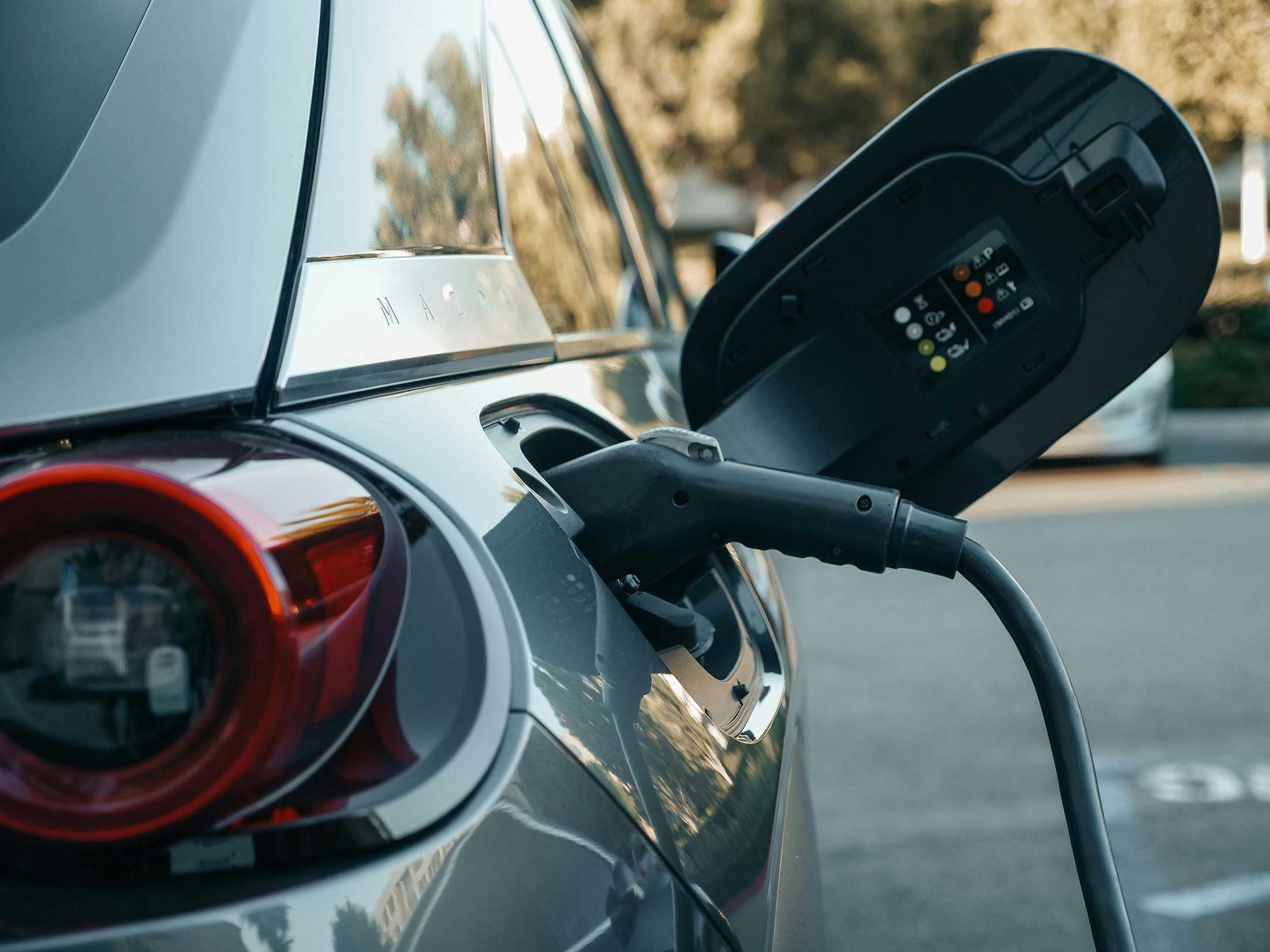 Side view of an EV being charged