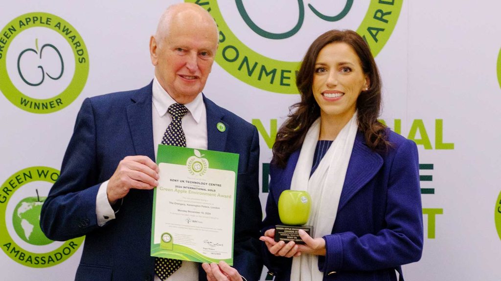 Green Apple Awards winner with certificate and trophy